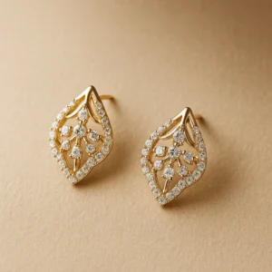 Geometric leaf silver alloy stud earrings with American diamonds.|