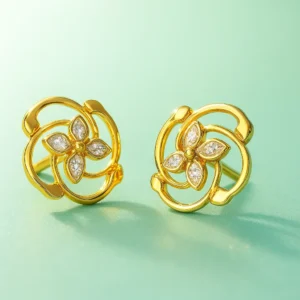 Floral swirl gold stud earrings with diamond detailing