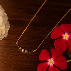 Minimal diamond accent mangalsutra with graceful floral charm