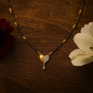 Heart pendant mangalsutra with dual tone finish and american diamond accent